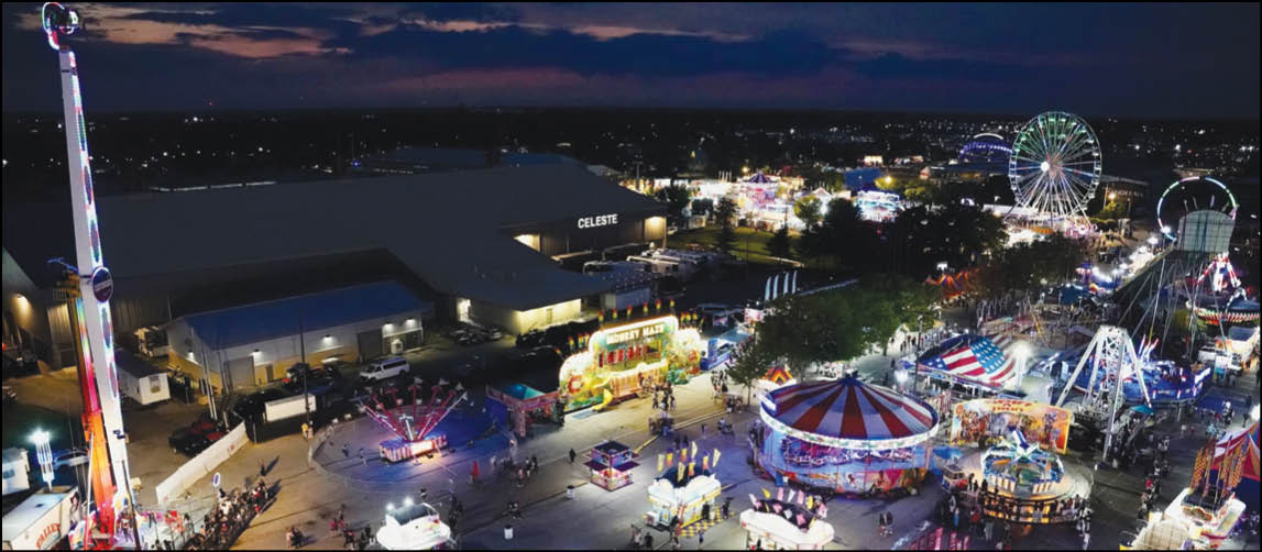 A carnival with lots of lights and rides. Description generated by AI
