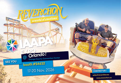 Two adults wearing casual clothing and sunglasses are seated in a roller coaster car decorated with a golden Egyptian pharaoh design, with a roller coaster track and promotional text for Reverchon at the IAAPA Expo in Orlando in the background. Description generated by AI