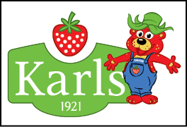 A red strawberry with green leaves is centered above white text on a green background that partially reads “kar" with the year 1921 below. Description generated by AI