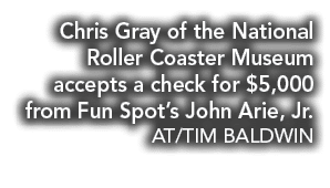 Chris Gray of the National Roller Coaster Museum accepts a check for $5,000 from Fun Spot’s John Arie, Jr. AT/TIM BAL...