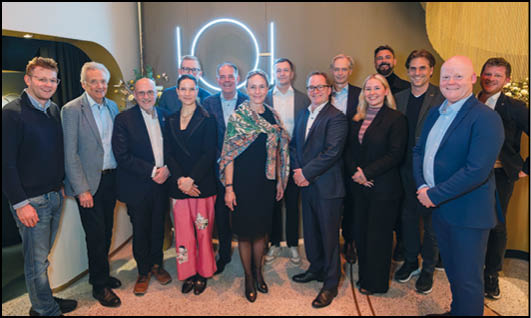 A group of people posing for a picture. Description generated by AI