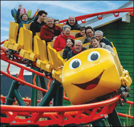 A group of people riding a roller coaster. Description generated by AI