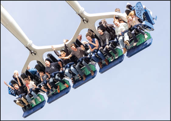 A group of people are riding a carousel. Description generated by AI