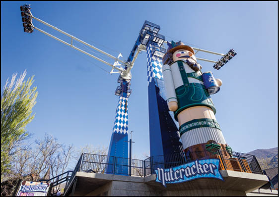 A large statue of a man in a hat and a blue and white checkered shirt. Description generated by AI