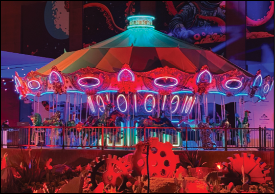 A carousel with a colorful top and a red roof. Description generated by AI