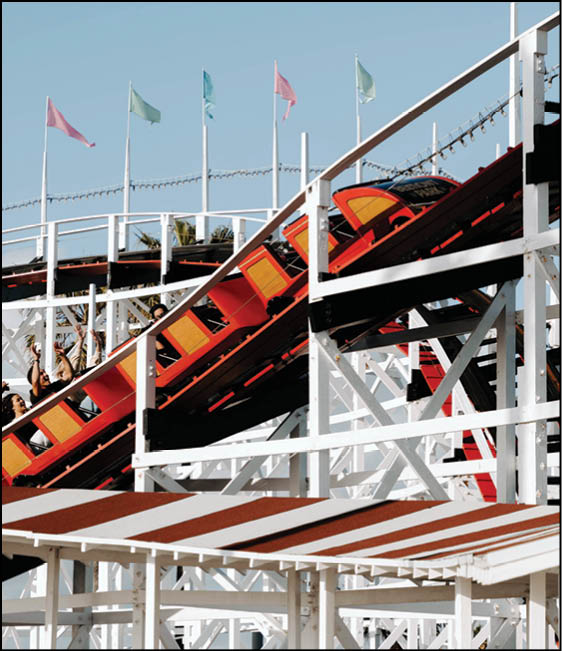 A roller coaster with a red and yellow car. Description generated by AI