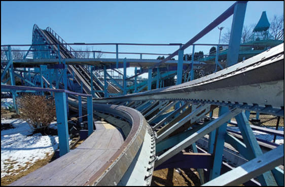 A roller coaster with a wooden track. Description generated by AI