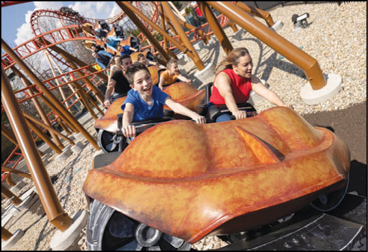 A group of people riding a roller coaster. Description generated by AI