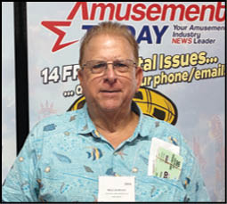 A man wearing a name tag and a Hawaiian shirt. Description generated by AI