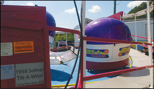 A red box with a yellow and pink wheel. Description generated by AI