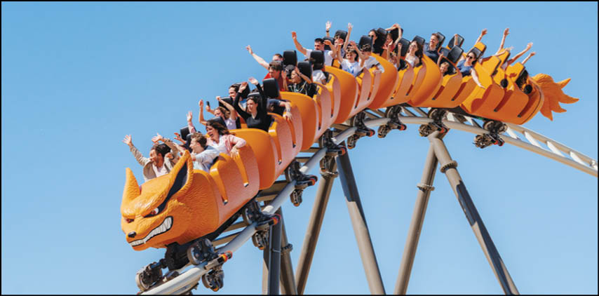 A group of people are riding on a roller coaster. Description generated by AI