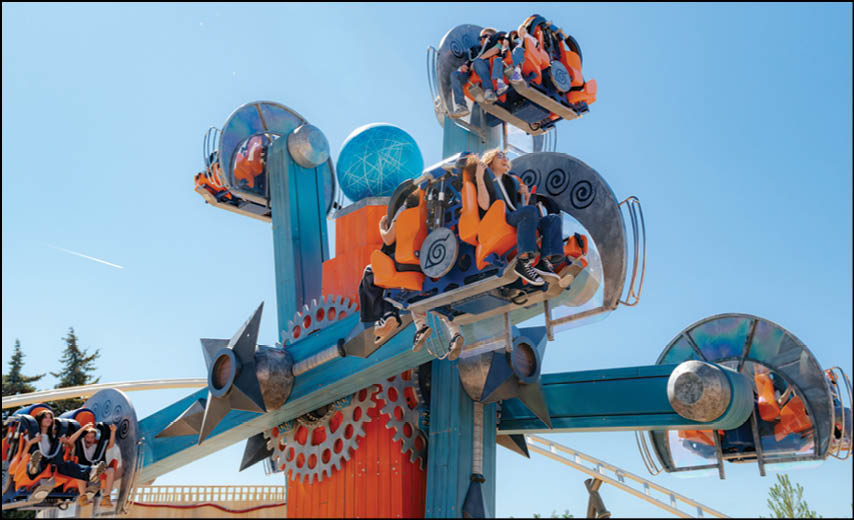 A large blue and orange ride with people riding in it. Description generated by AI