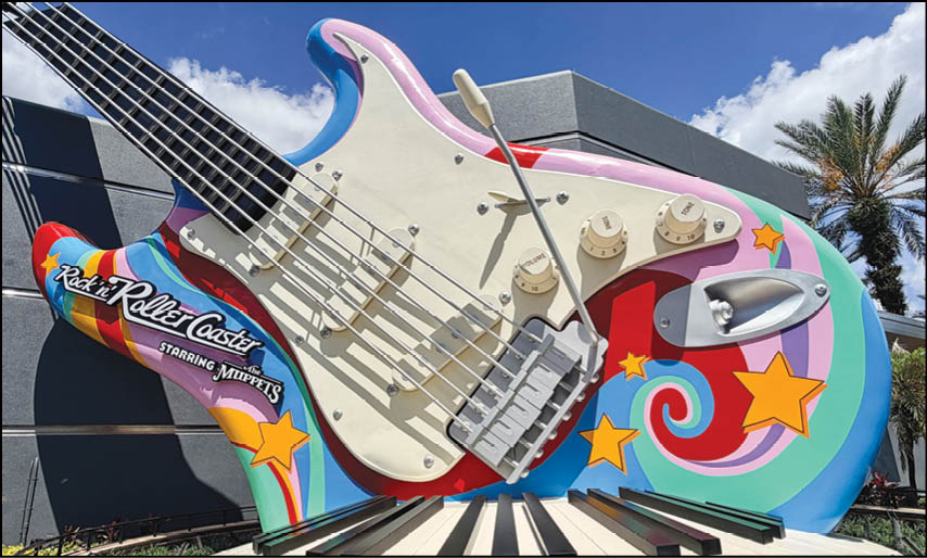 A large guitar sculpture is on display. Description generated by AI