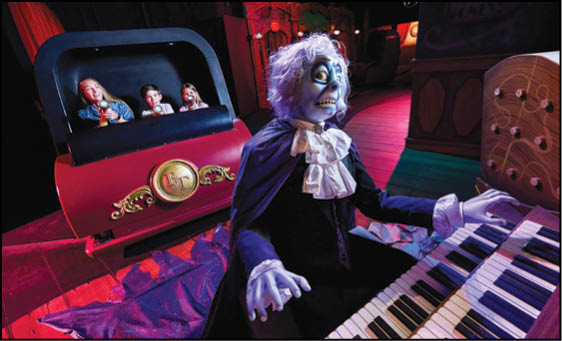 A man in a costume is playing a piano. Description generated by AI