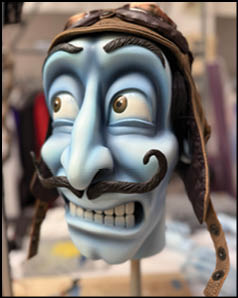 A blue and white mask with a mustache. Description generated by AI