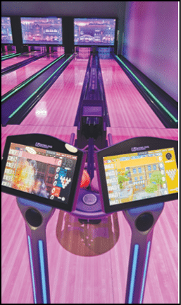 Two bowling machines with purple and pink lights. Description generated by AI