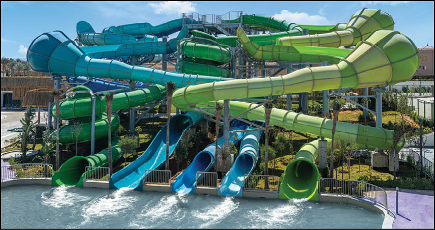 A large water slide with many different colored tubes. Description generated by AI