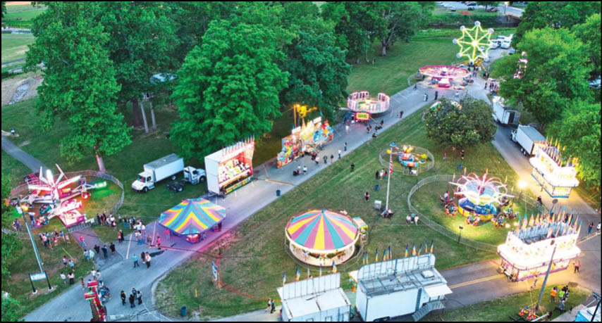 A blue and yellow tent with a sign that says “Buy or Reload Cards Here". Description generated by AI