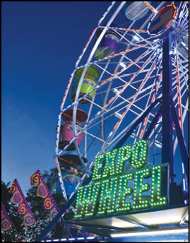 A blue and yellow tent with a sign that says “Buy or Reload Cards Here". Description generated by AI