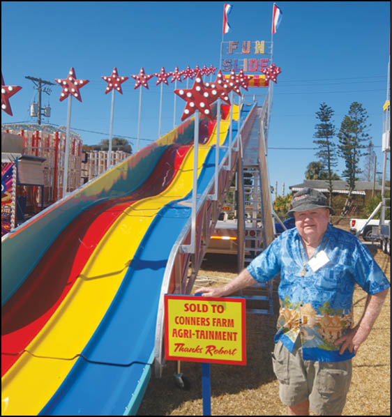 A blue and yellow tent with a sign that says “Buy or Reload Cards Here". Description generated by AI