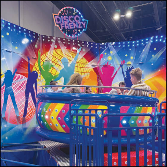 A carnival with lots of lights and rides. Description generated by AI