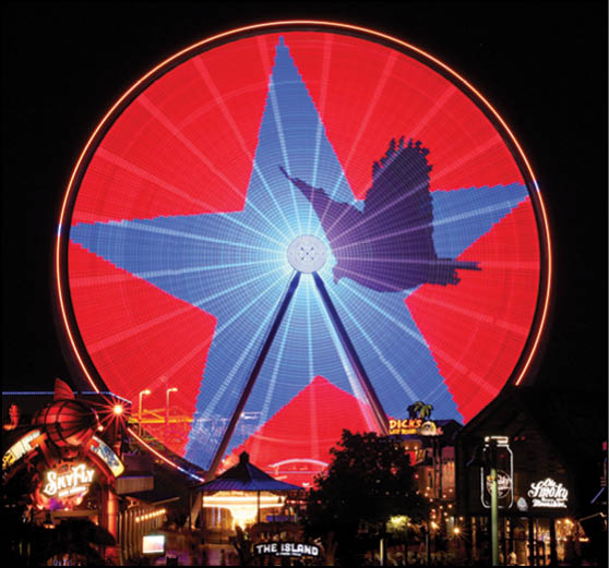 A blue and yellow tent with a sign that says “Buy or Reload Cards Here". Description generated by AI