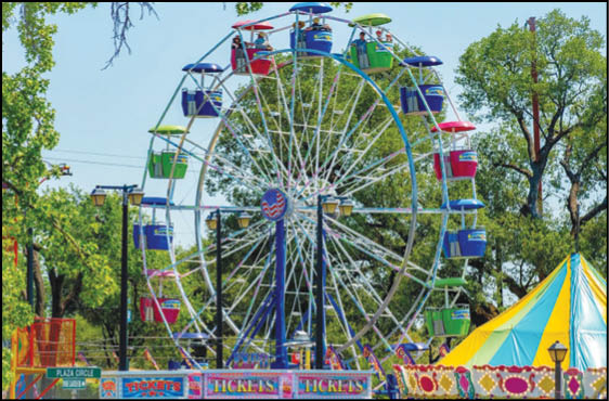 A blue and yellow tent with a sign that says “Buy or Reload Cards Here". Description generated by AI