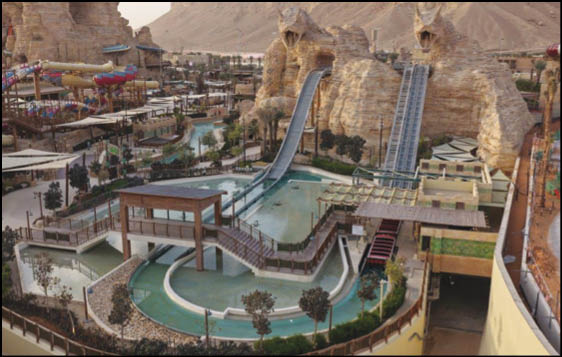 A green and blue roller coaster with a yellow center. Description generated by AI