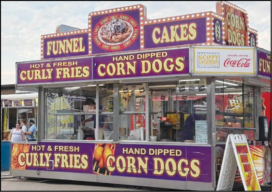 A blue and yellow tent with a sign that says “Buy or Reload Cards Here". Description generated by AI