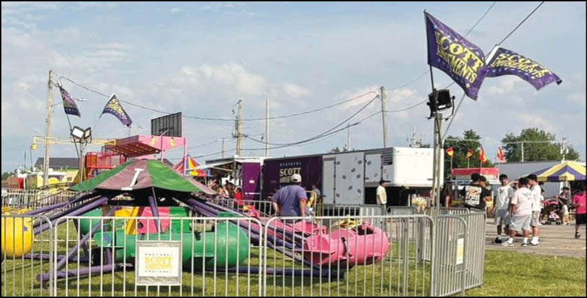 A blue and yellow tent with a sign that says “Buy or Reload Cards Here". Description generated by AI