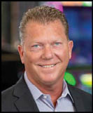 A man wearing a white shirt and black jacket. Description generated by AI