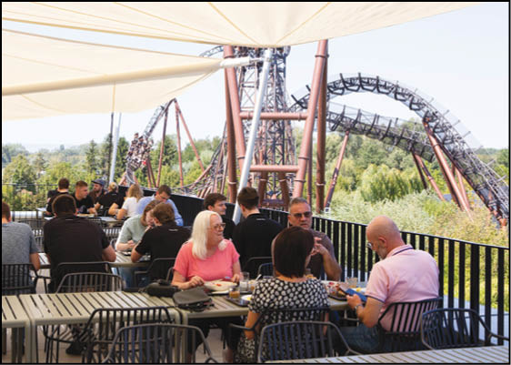 A roller coaster with a blue and yellow track. Description generated by AI