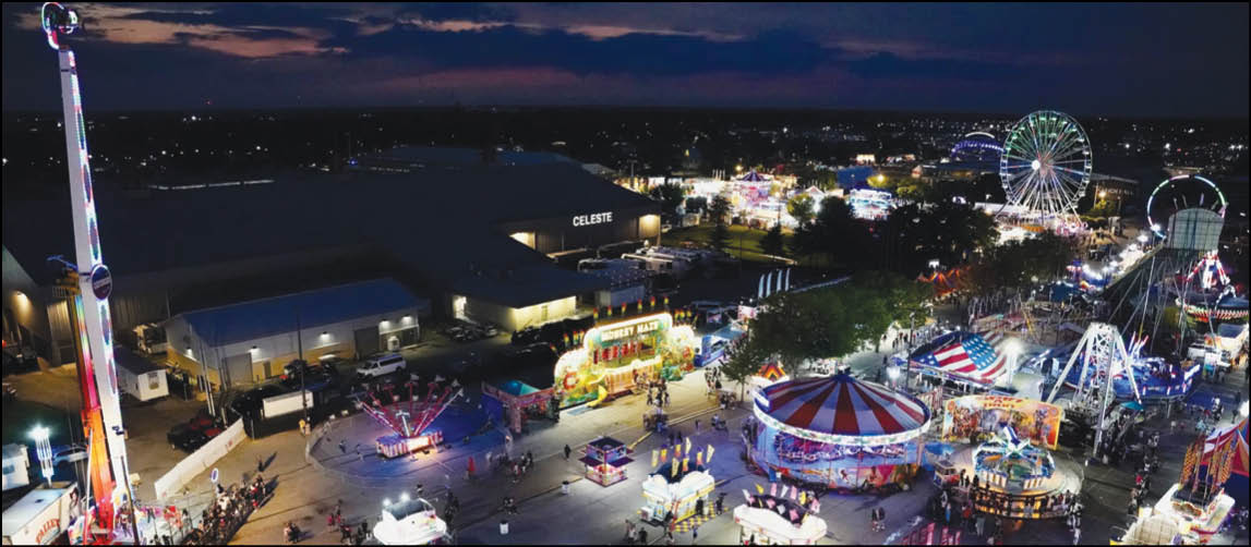 A carnival with lots of lights and rides. Description generated by AI