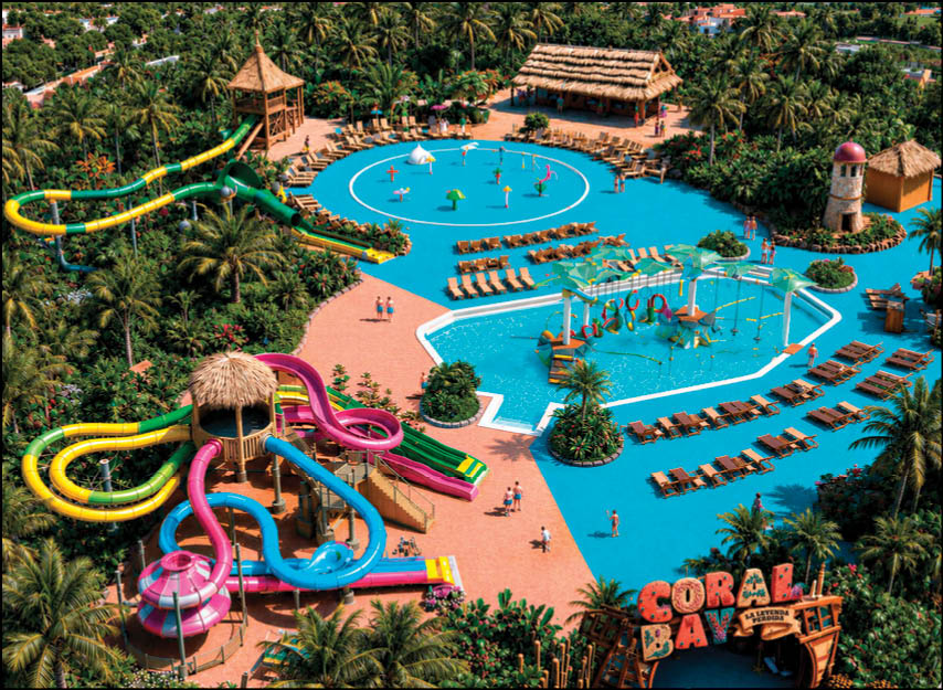 A vibrant water park with multiple colorful water slides, splash pads, lounge chairs, palm trees, and people enjoying various water activities surrounded by lush greenery. Description generated by AI